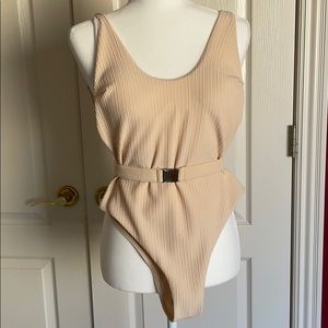Tan belted one piece swimsuit